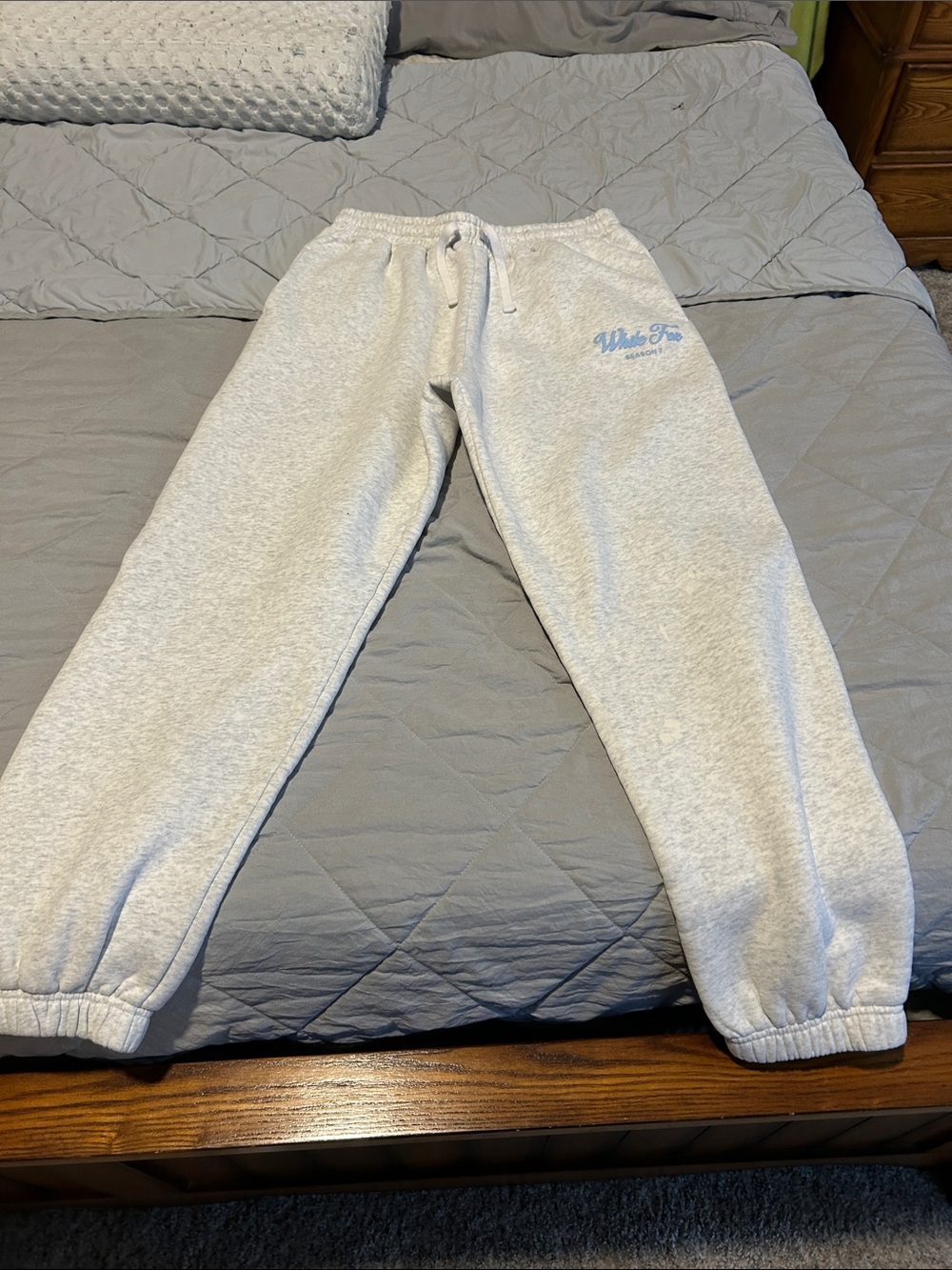 White Fox Women’s Fleece Sweatpants with Light Blue white Fox logo.